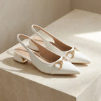 White pointed-toe slingback block heels