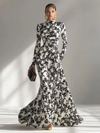 Model wearing the abstract floral mermaid maxi dress in Red