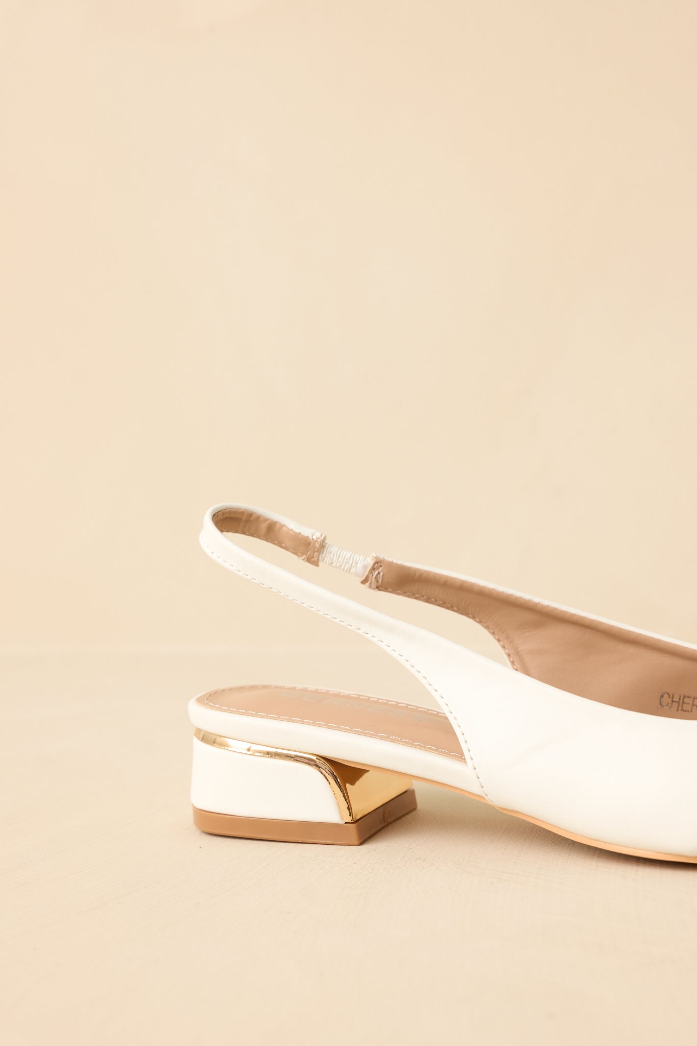 White pointed-toe slingback block heels - top view