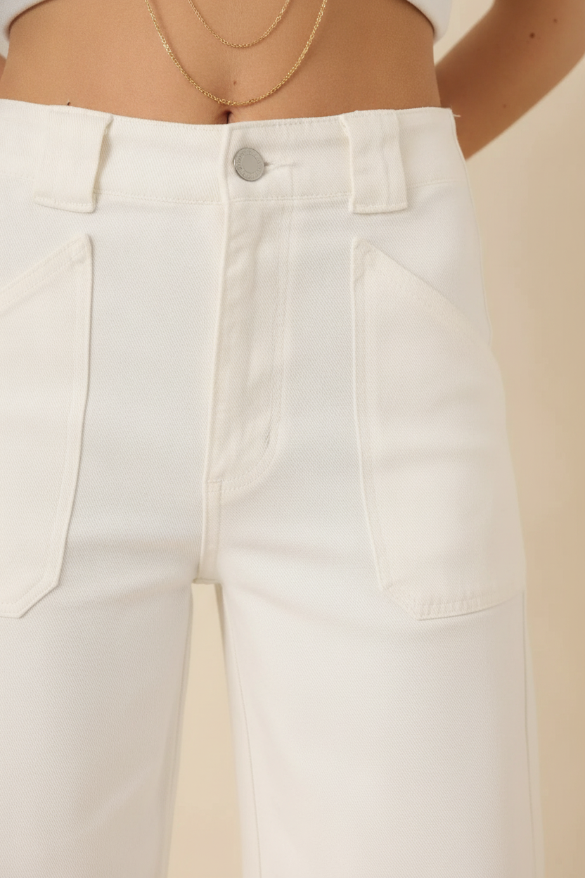 Close-up detail of white wide-leg jeans fabric and stitching